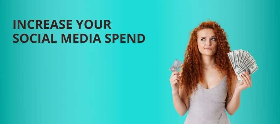 Boost your marketing spend graphic - red-headedwoman on a blue back drop holding cash and a credit card